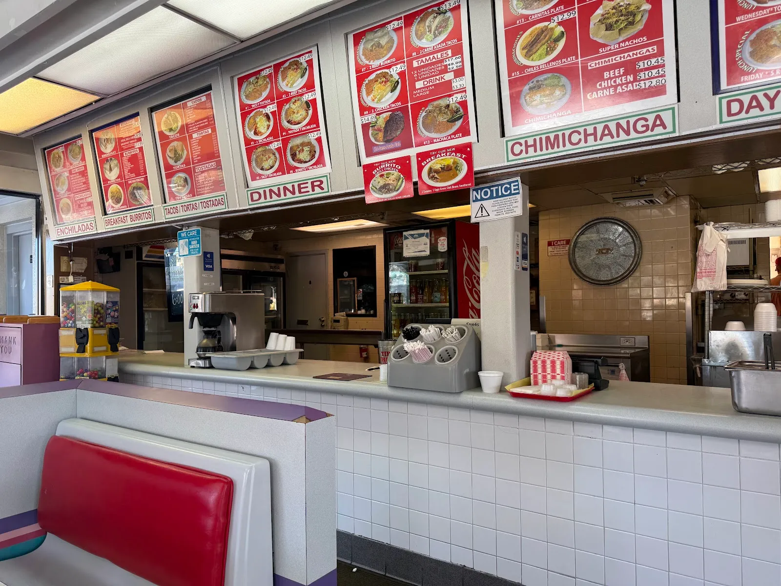 Order counter with overhead menu boards and a red booth inside Coronados
